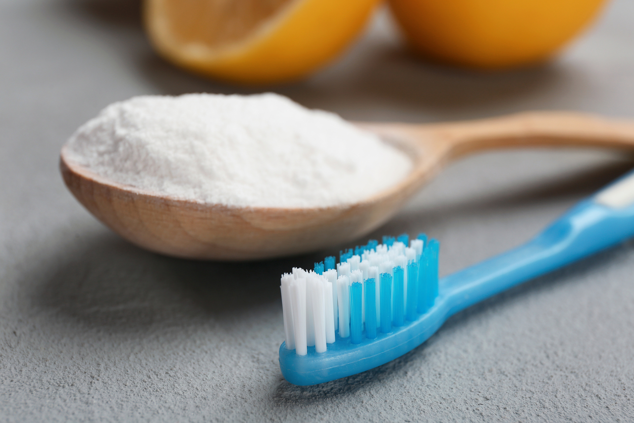 Baking soda and lemon with a toothbrush